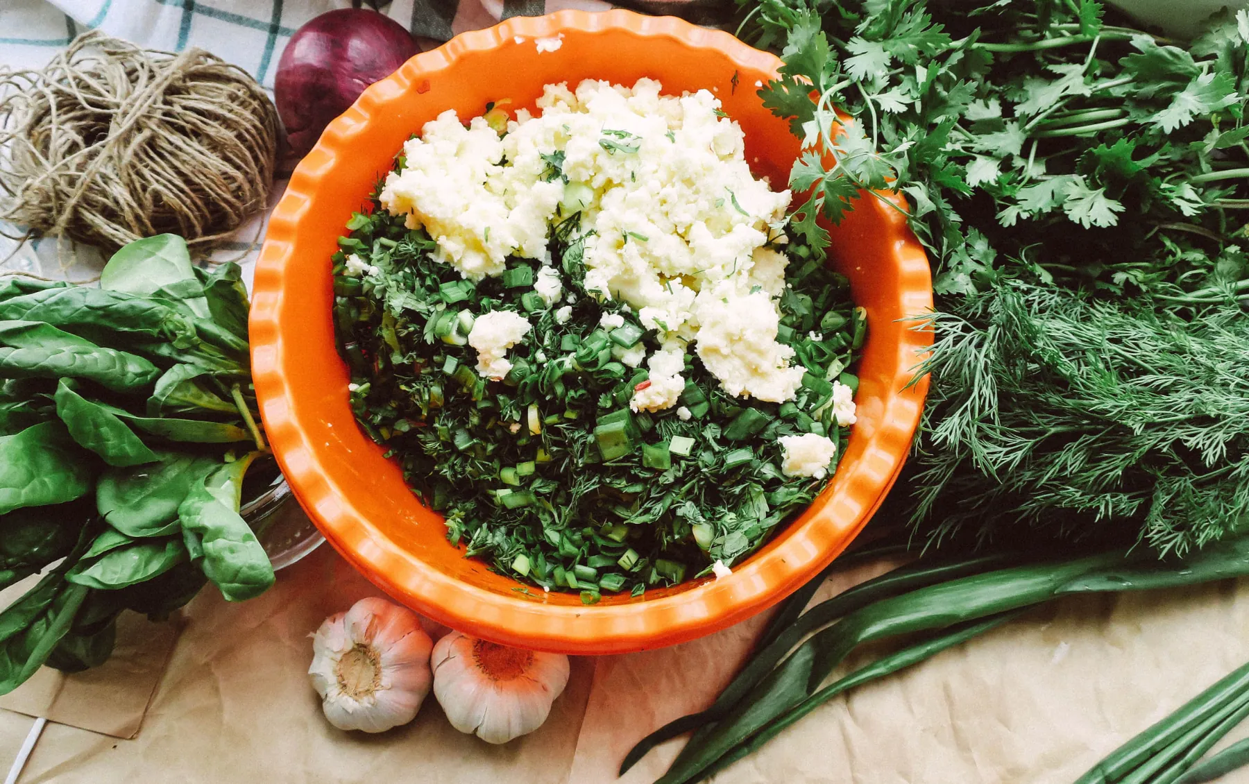 Fresh spinach, herbs, spring onions and cheese ready for gözleme