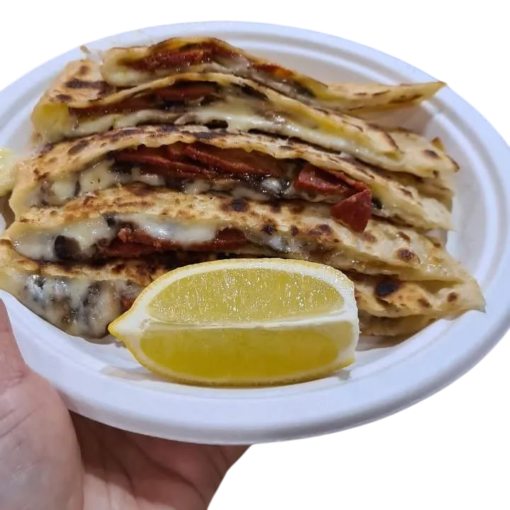 Sliced sucuk, mushroom and cheese gözleme served with lemon